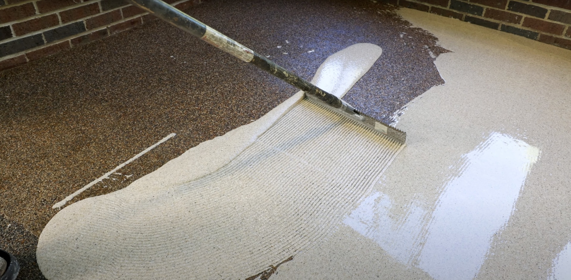 Professional concrete finishing work showing smooth, level surface installation techniques