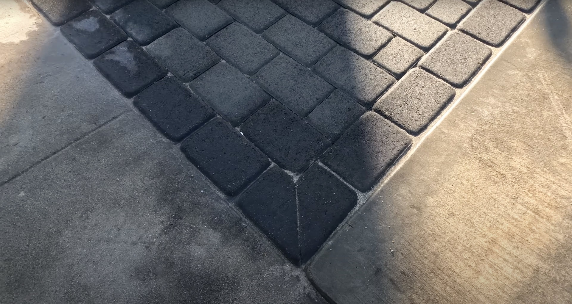 High-quality decorative concrete pavers being installed with professional precision