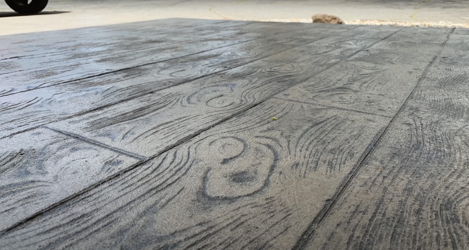 Beautiful stamped concrete with wood grain pattern showing detailed texture and craftsmanship