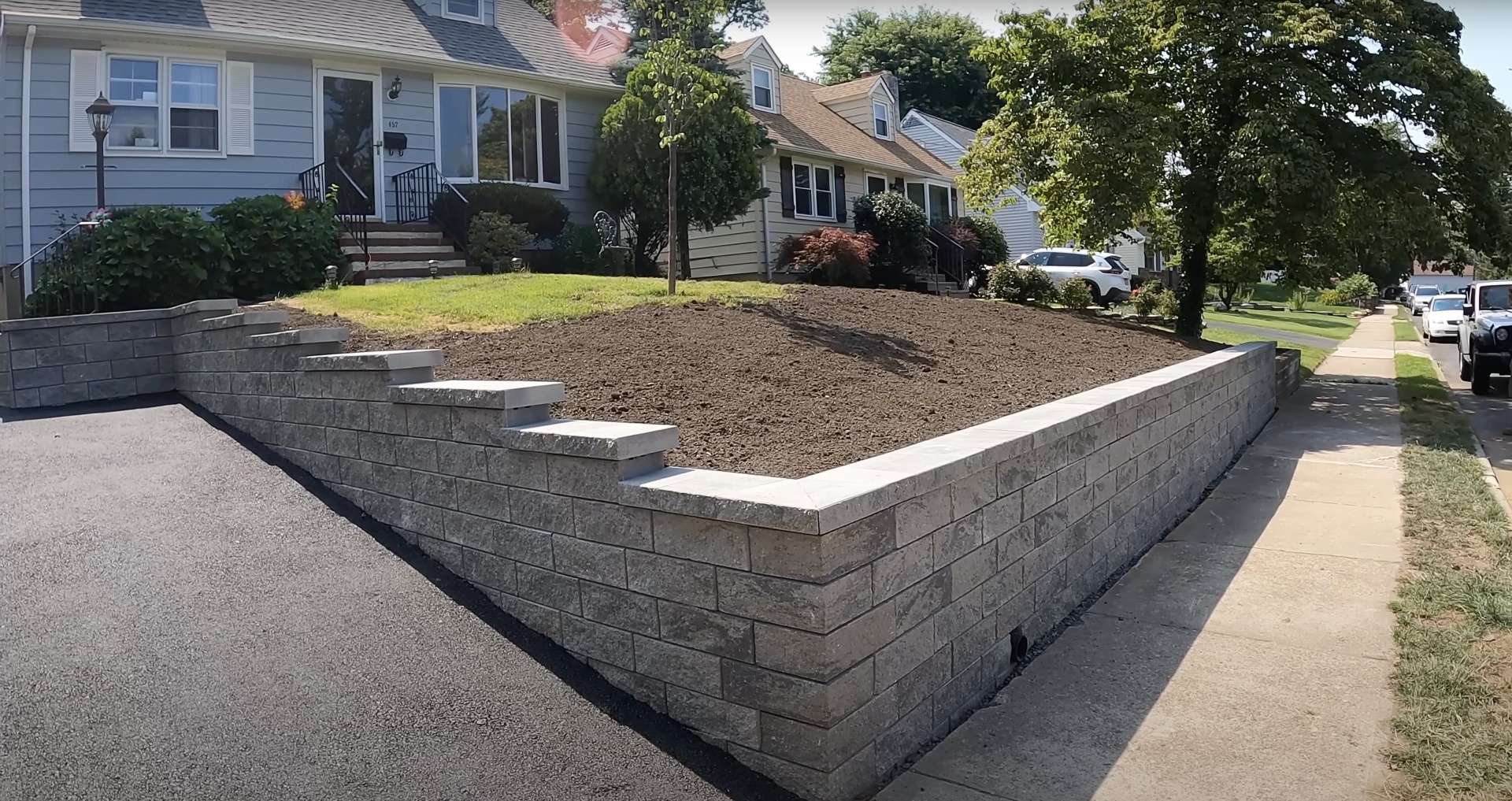 Professional concrete retaining wall construction in Haltom City residential area