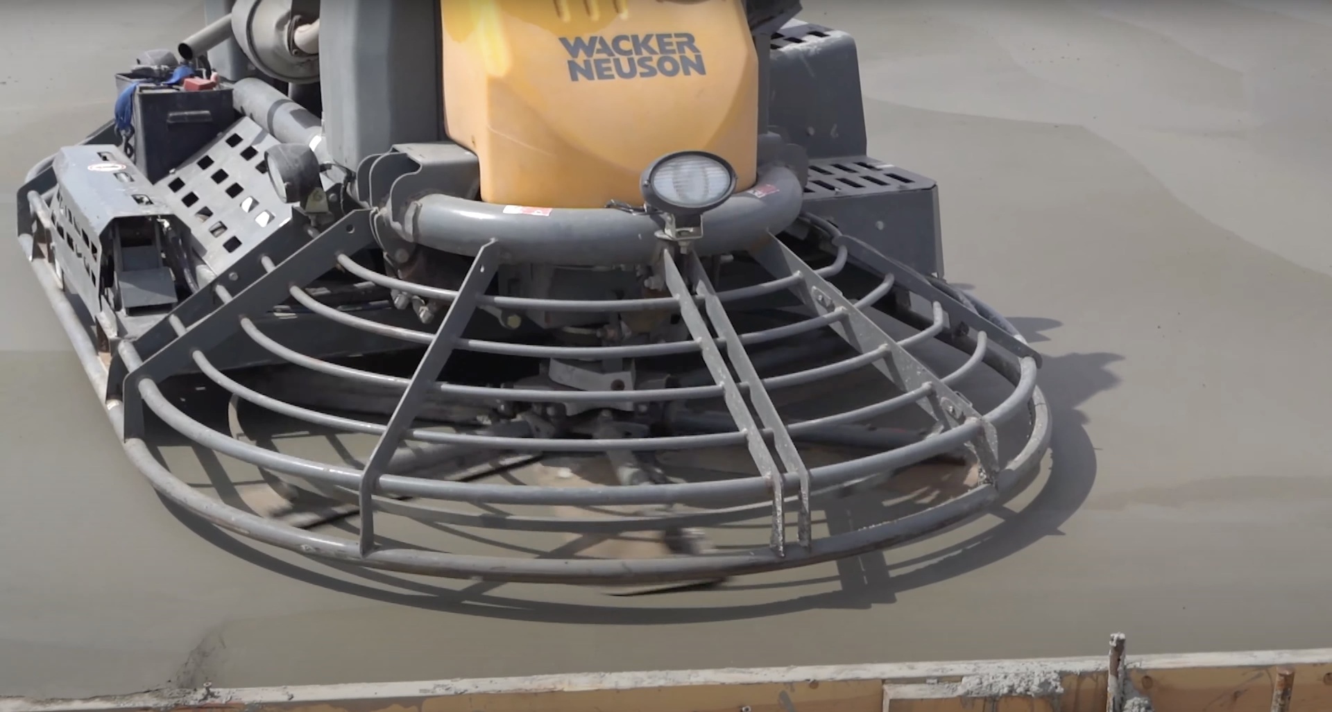 Professional concrete finishing equipment showing power trowel used for smooth surface preparation