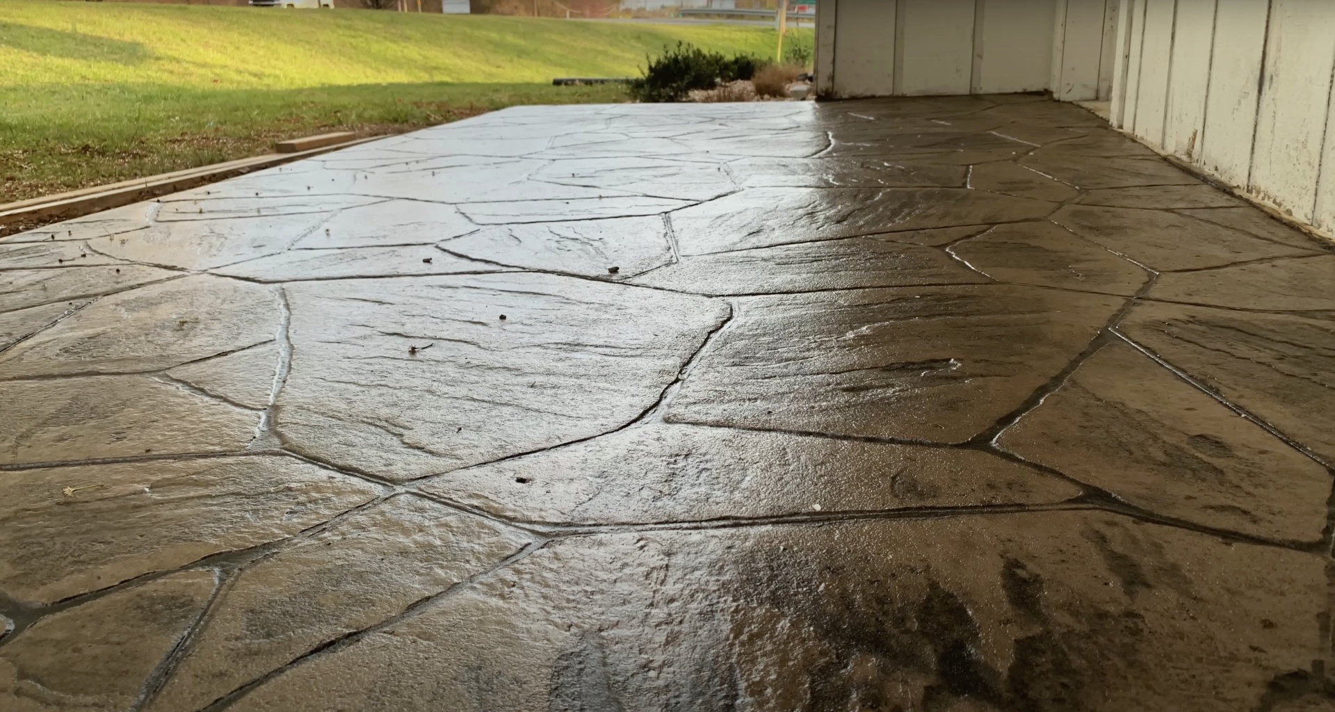 Well-maintained concrete patio with proper jointing and drainage showing long-term durability